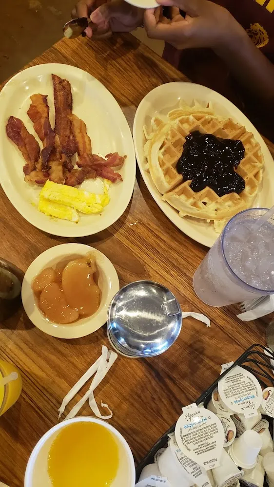 Bacon with Eggs and Waffles with Blueberry and Apple Toppings
